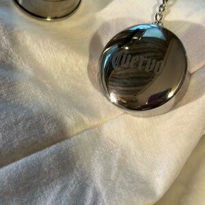 Cuervo folding travel stainless cup with clasping chain One scratch on bottom.